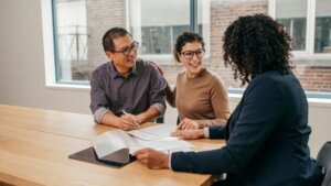 three people discussing financial possibilities