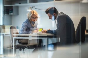 two business people discussing in an office