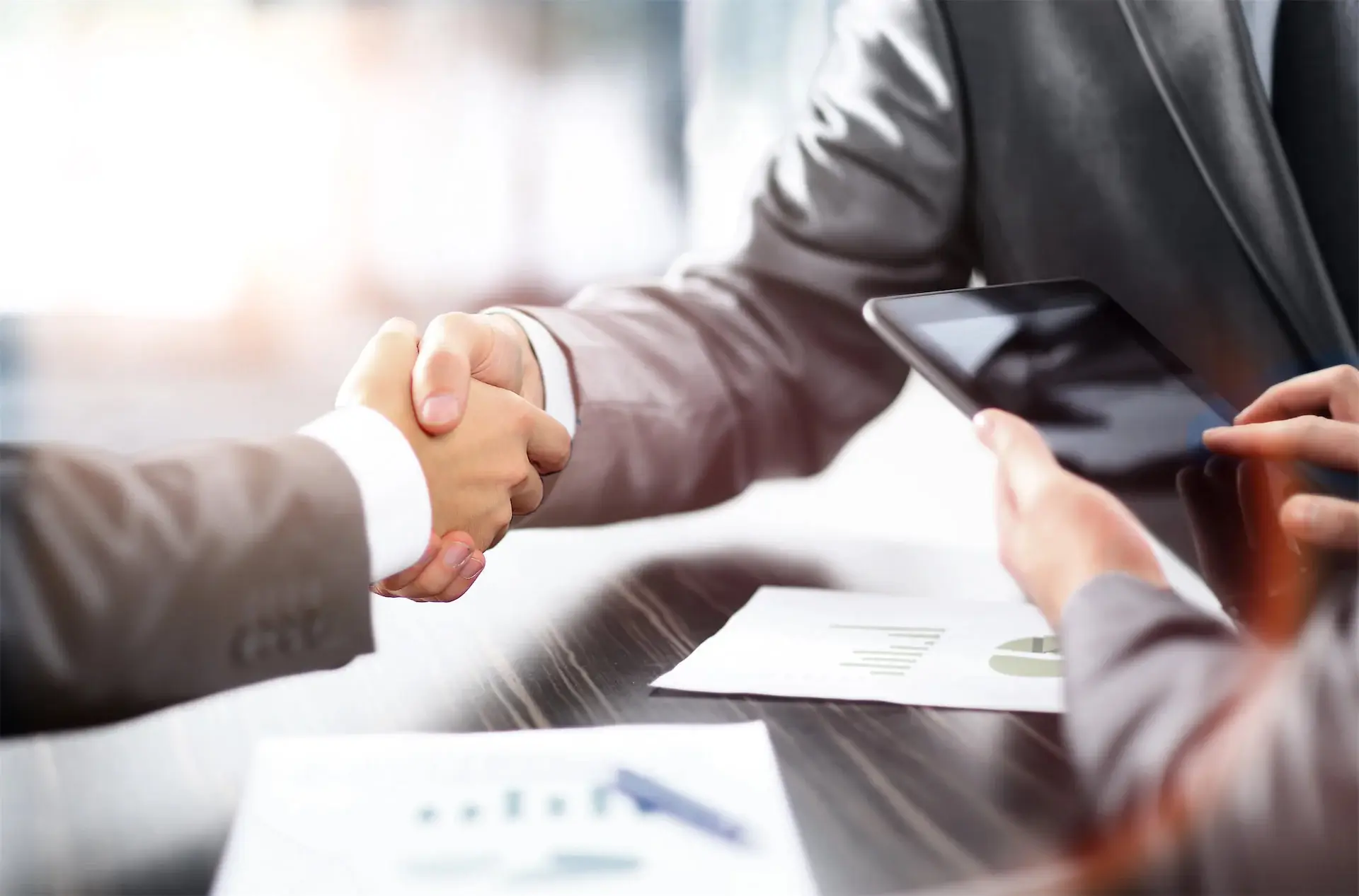 Business-shaking-hands-in-office