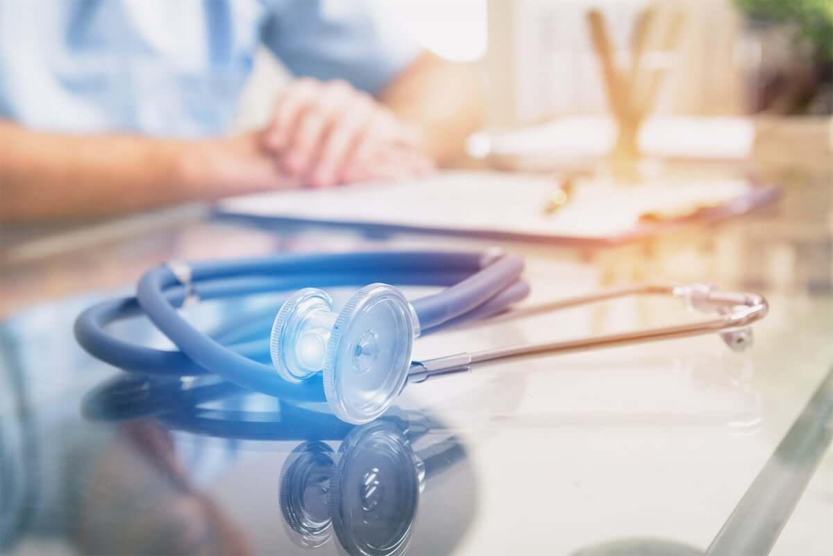 Close up of stethoscope and doctor